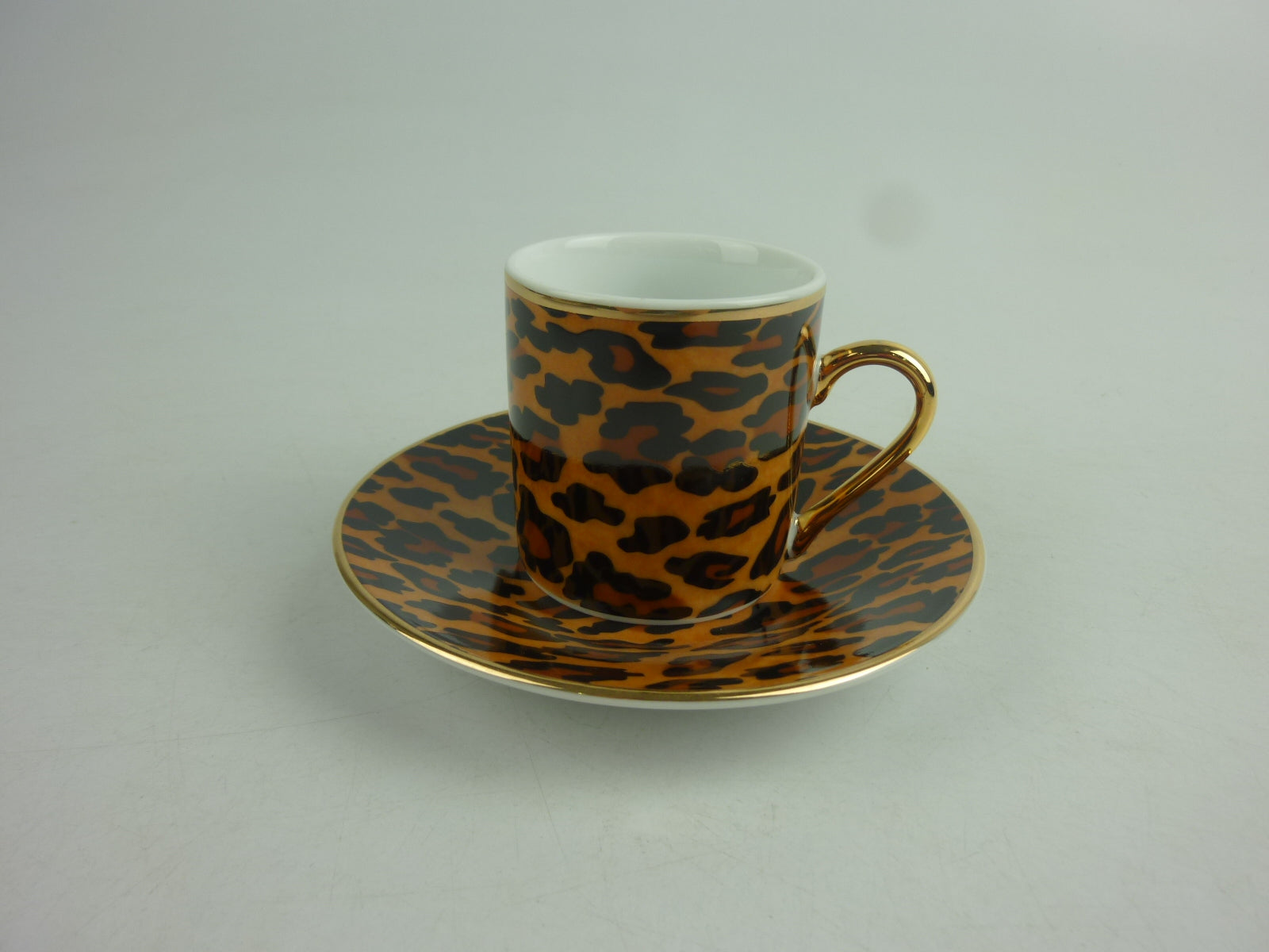 Tazzine per caffè tipo espresso con piattino, bordate in oro e decoro a macchie di leopardi